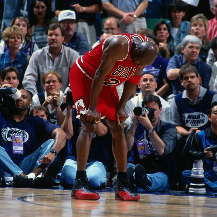 SALT LAKE CITY, UT - JUNE 13: Michael Jordan #23 of the Chicago Bulls rests during Game Five of the 1997 NBA Finals played against the Utah Jazz on June 11, 1997 at the Delta Center in Salt Lake City, Utah. The Chicago Bulls defeated the Utah Jazz 90-88.  NOTE TO USER: User expressly acknowledges and agrees that, by downloading and or using this photograph, User is consenting to the terms and conditions of the Getty Images License Agreement. Mandatory Copyright Notice: Copyright 1997 NBAE (Photo by Nathaniel S. Butler/NBAE via Getty Images)